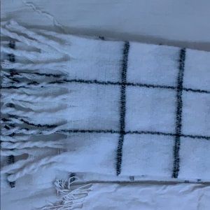 a black and white scarf and a white scarf